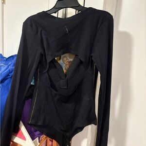 Nike women’s long sleeve bodysuit button up front and football cutout shape back